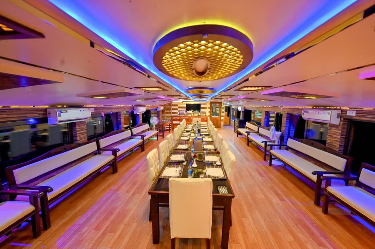 Luxury houseboat cruising through Kerala's serene backwaters